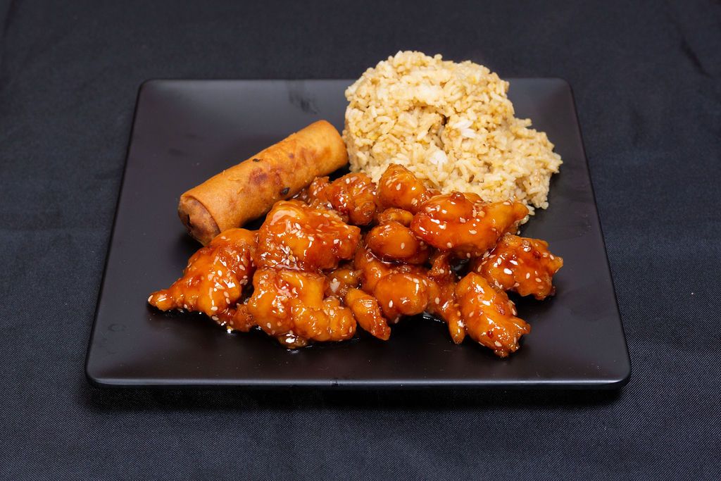 Sesame chicken with fried rice and an egg roll